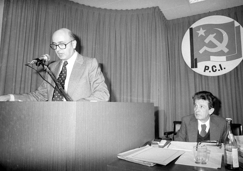 ** FILE ** Giorgio Napolitano, left, speaks to the Central Committee of the Communist Party in Rome in this April 12, 1976 black and white file photo. Napolitano, elected presidident by Italy's Parliament on Wednesday, May 10, 2006, is the first former Communist to ascend to Italy's top job _ president of the republic _ crowning a political life that has spanned half a century and been marked by a moderate, pro-Western stance. At right is Enrico Berlinguer, the Communist Party secretary at the time. (Ap Photo)